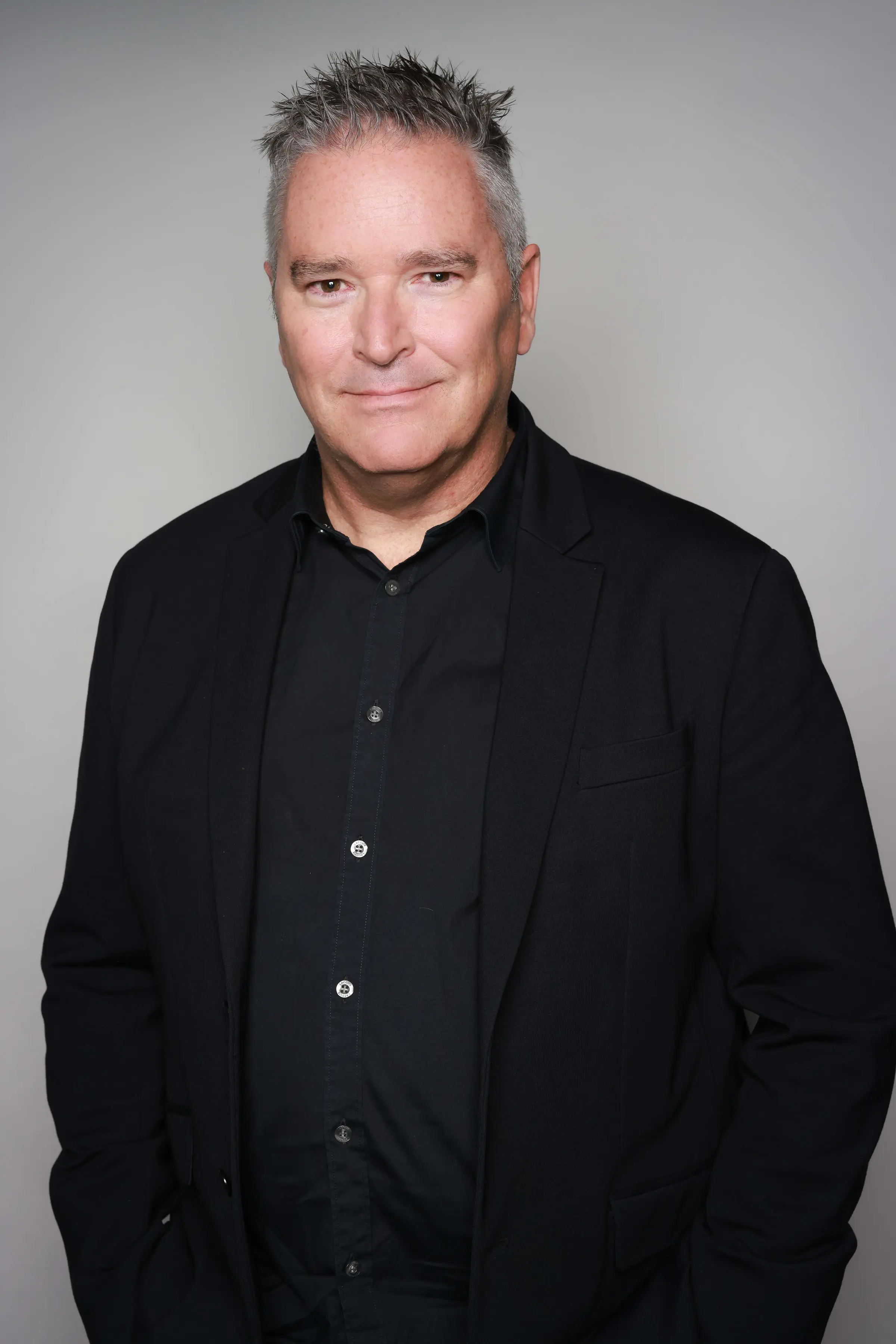 Corporate Headshots, Kenvue - studio backdrop, black jacket