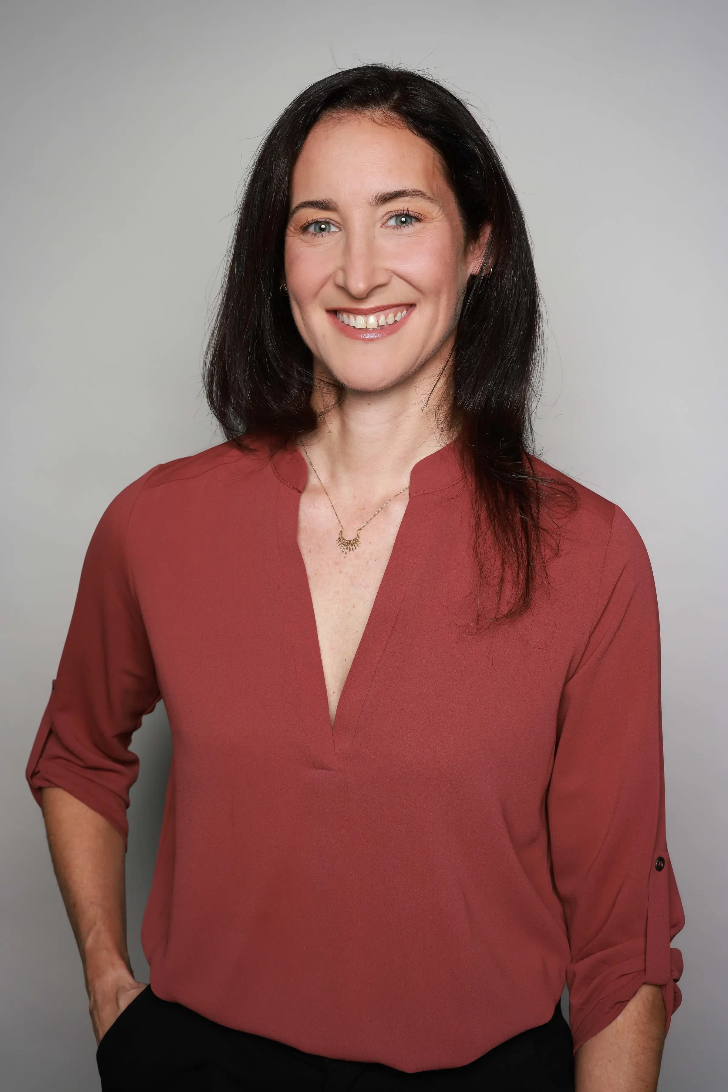 Corporate Headshots, Kenvue - studio backdrop, rust blouse
