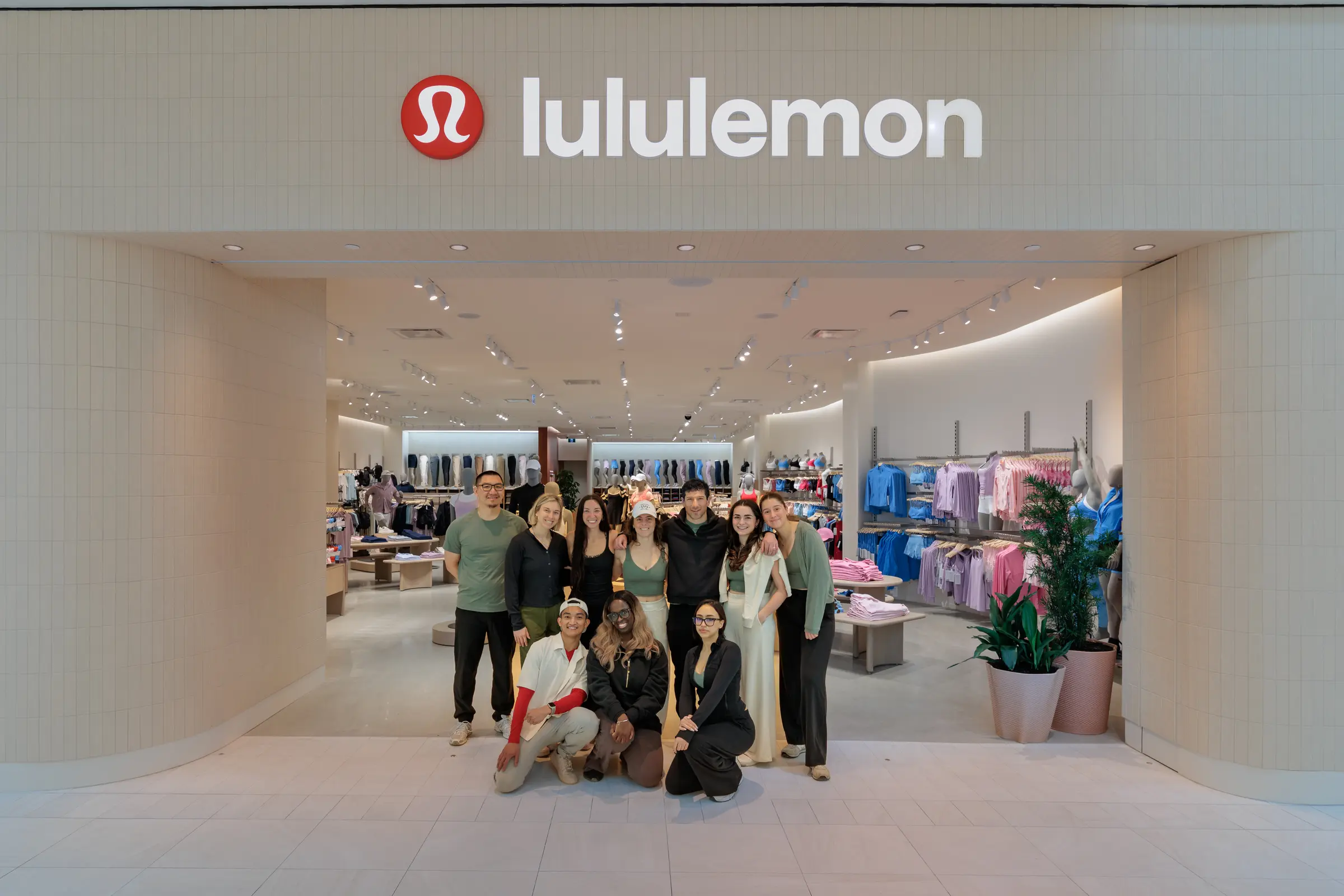 Corporate Headshots, Lululemon St-Bruno - the store team under the sign